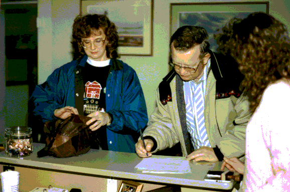 Galen & Mary signing paperwork